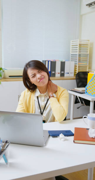 istock asian woman muscle sore office 2188807497