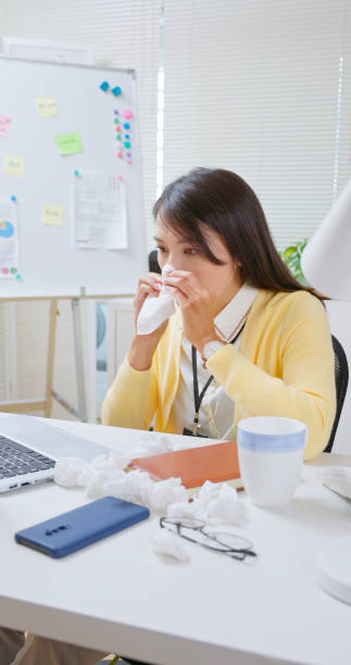 istock Asian woman office cold symptoms 2188807634