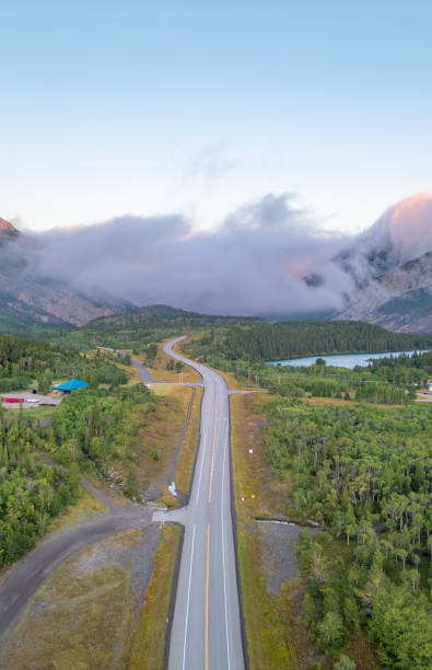 istock Scenic Highway Through Lush Forest and Mountains in Alberta, Canada at Sunrise 2188809250