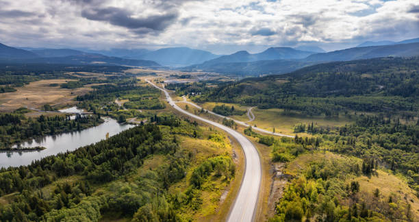 istock Scenic Highway Winding Through Majestic Landscape in Alberta, Canada with Lush Forests and Mountains 2188809539
