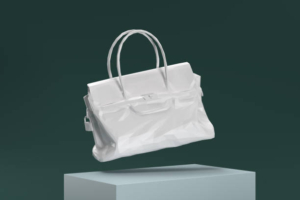 istock A white purse is suspended in midair, with its handle visible 2188813946