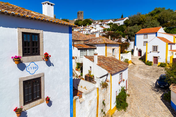 Obidos, Portugal - circa September, 2017: Medieval town of Óbidos seen from the top of the walls. The village is a tourist attraction in central Portugal