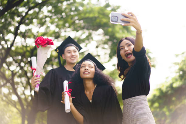 istock Happy and excited students in their graduation ceremony. 2188814030