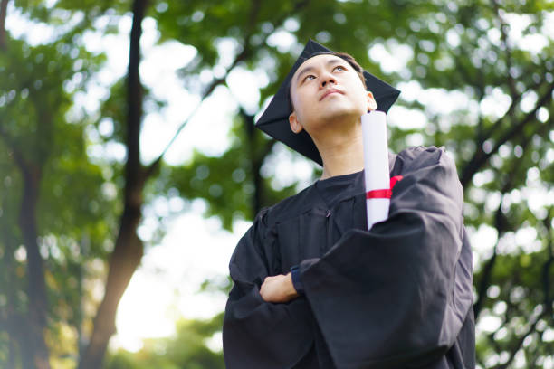 istock Happy and excited graduated students in their graduation ceremony. 2188814072