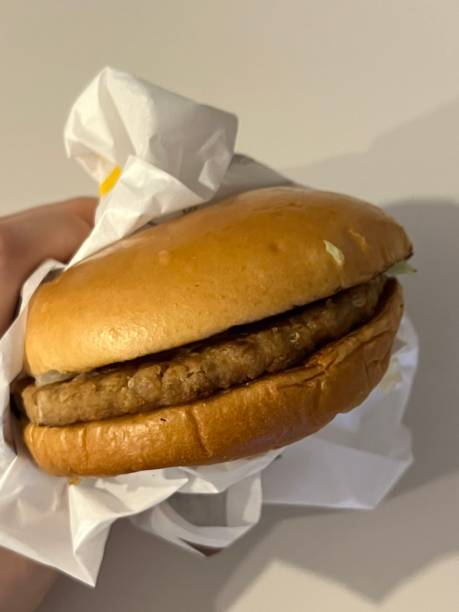 istock Juicy burger layered with a thick beef patty, fresh lettuce, tomatoes, cheese, and a soft sesame bun. A satisfying, flavorful classic perfect for any craving. 2188816441