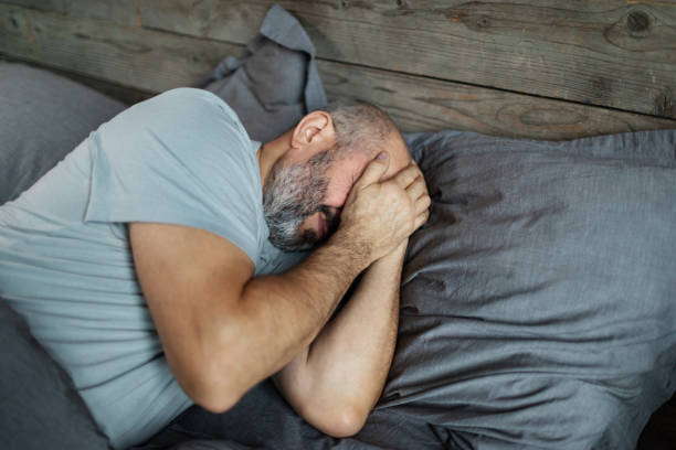 istock Mature man feeling depressed in bedroom 2188816641