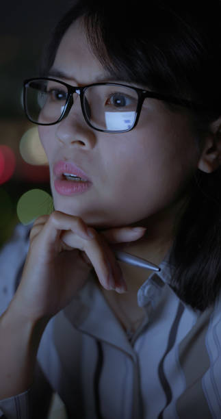 istock business woman work at night 2188816672