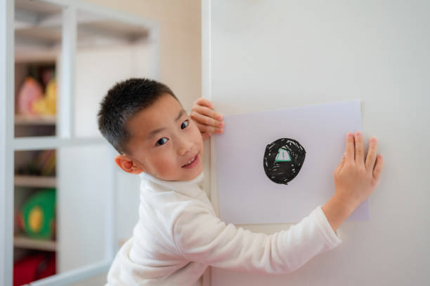 istock Asian children show their hand drawings 2188818272