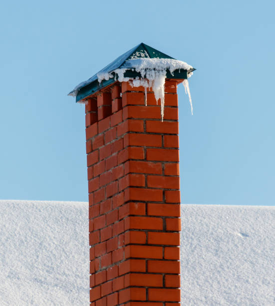 istock A brick chimney with icicles on top 2188818879