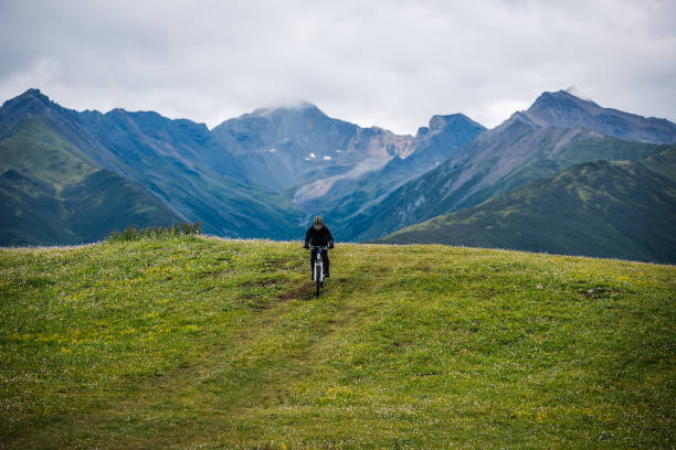 istock Riding mountain bike on grassland mountain top 2188819309