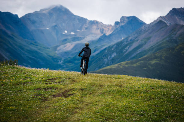 istock Riding mountain bike on grassland mountain top 2188819367