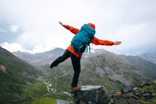 istock Hiking woman on high altitude mountain top 2188820487