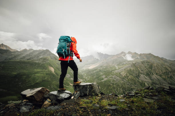 istock Hiking woman on high altitude mountain top 2188820508