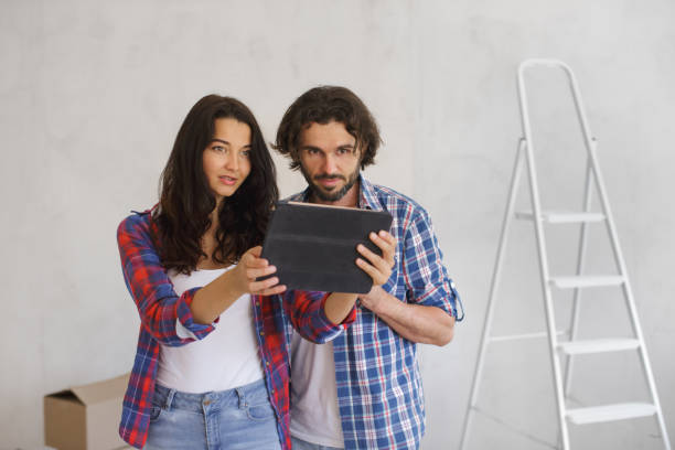 istock Focused Couple Using Tablet for DIY Home Renovation Planning 2188820629