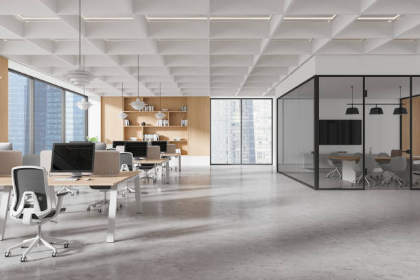 istock Modern open-plan office with glass meeting room and workstations in a bright corporate space. 3D Rendering 2188821726