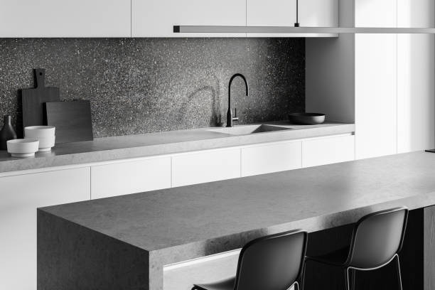 istock Minimalist modern kitchen interior with gray countertops and white cabinets in sleek design. 3D Rendering 2188822062