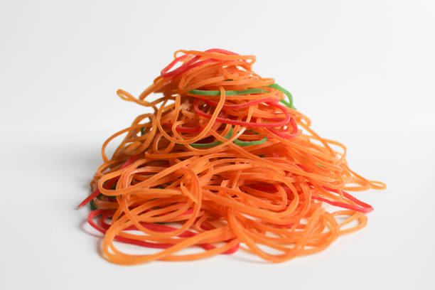 Colorful rubber band pile, isolated on white background