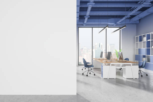istock Empty white wall mockup next to modern office space with desks and chairs. 3D Rendering 2188823540