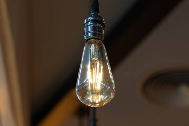 istock A vintage light bulb hanging from the ceiling. 2188824623