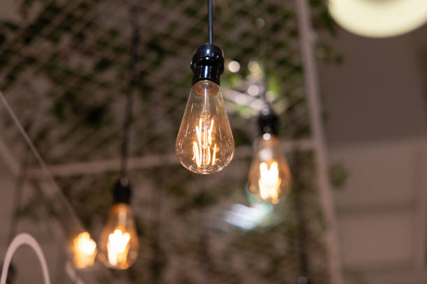 istock A group of light bulbs hanging from the ceiling 2188824748