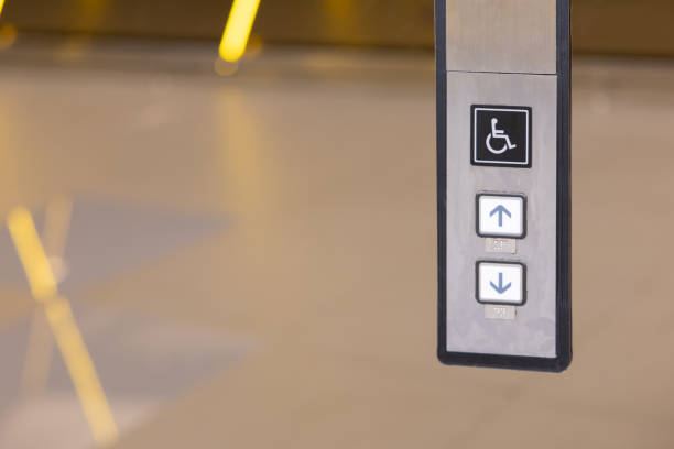 istock A silver and black elevator button with a wheelchair symbol on it. 2188824772