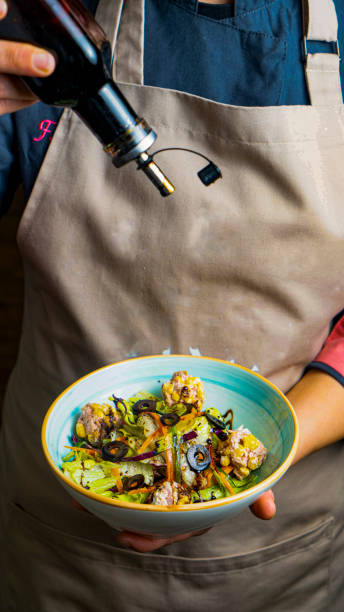 Freshly prepared dish topped with olive oil in a cozy kitchen setting
