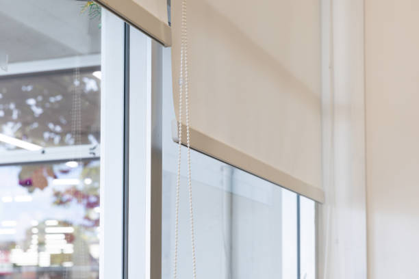 istock A white blind curtain is hanging from a window 2188827744