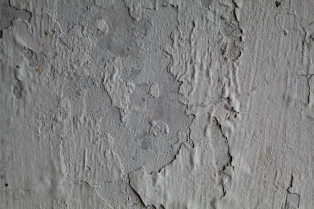 istock White wall paint peeling due to wet condition 2188828038