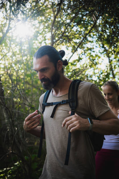 istock Hikers walking in the forest on a sunny day 2188828679