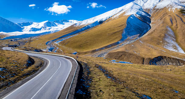 istock Aerial view  on the road surrounded by winter Landscape view 2188830469