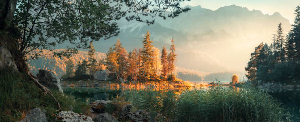 istock Panoramic landscape at a mountain lake in morning sunlight 2188831636
