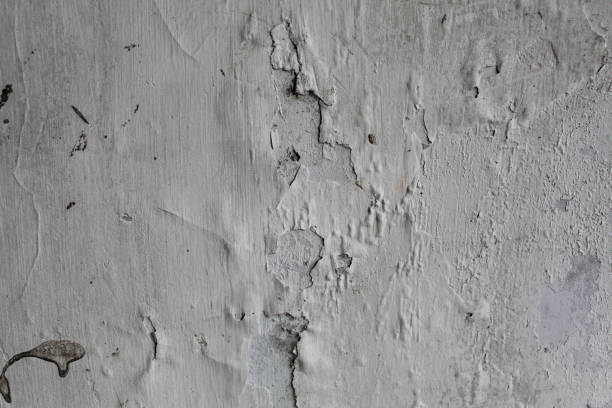 istock White wall paint peeling due to wet condition 2188832271
