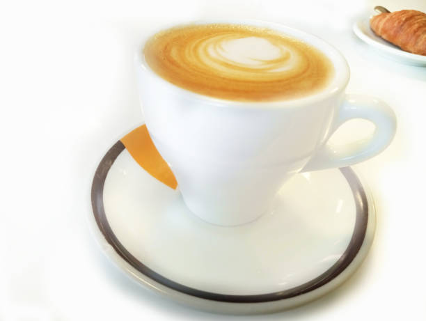 istock Cup of coffee with croissant on the white background. 2188837359