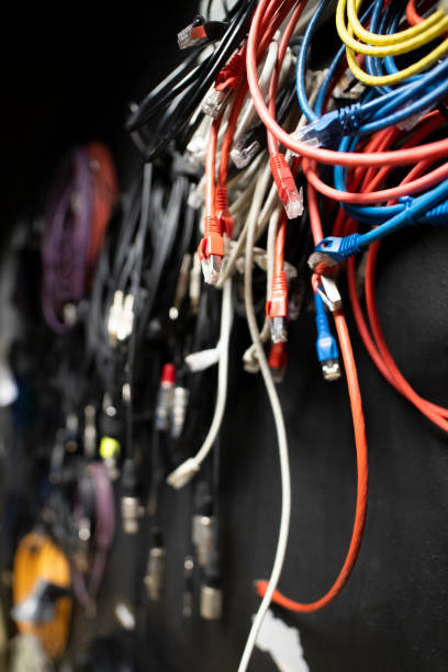 istock Lots of different audio and internet cables in a dark studio room 2188837554