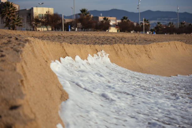 Sea foam and sand