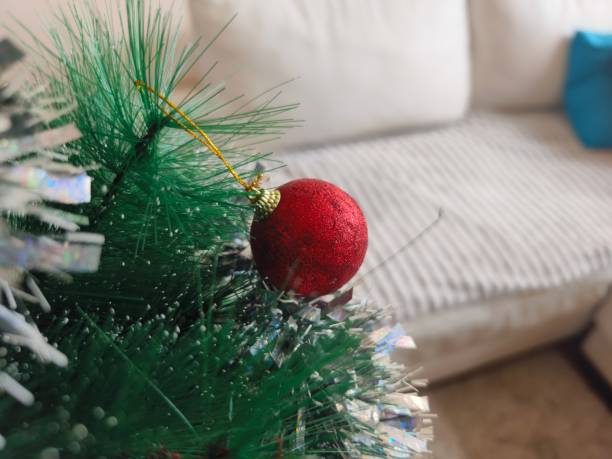 Christmas sphere ornament on Christmas tree in living room