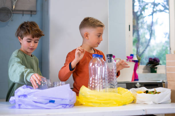 istock Children sorting garbage in the kitchen promoting environmental awareness 2188849437