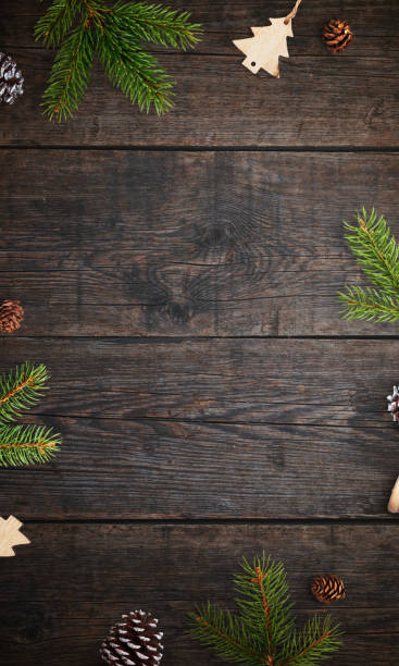 istock Rustic wooden table with Christmas branches and decorations, top view flat lay, featuring an empty space for a holiday greeting or festive message 2188851320