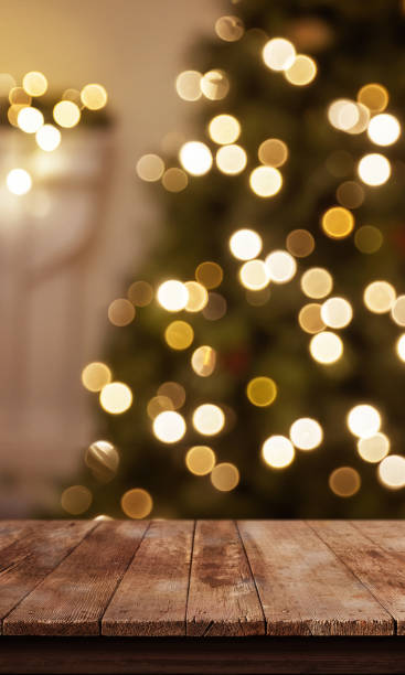 istock Rustic wooden table with a bokeh background of Christmas tree lights, front view, perfect for promoting holiday sales, festive products, or seasonal campaigns 2188851322