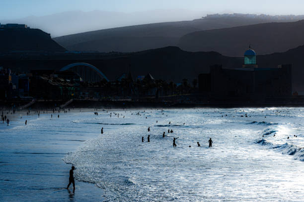 Las Canteras beach in Las Palmas. Playa de Las Canteras in Gran Canaria, Canary Islands is a long strip of sand that stretches for miles. This picture was taken in October 2024.