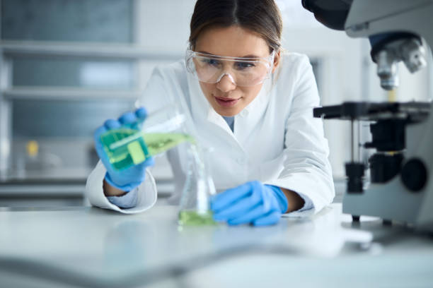 istock Female scientist mixing  substances in laboratory. 2188864029