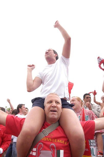 Taksim Square - Istanbul, Turkey - May 25, 2005: Liverpool football team fans drink lots of beer and have fun while waiting for game time in Taksim Square before the UEFA CHAMPIONS LEAGUE FINAL match against Milan on May 25, 2005 in Istanbul, Turkey. The season final was played at the Istanbul Atatürk Olympic Stadium between Liverpool of England and Milan of Italy. The regular time and extra time ended 3-3 in the final, and Liverpool won the championship by defeating Milan 3-2 in the penalty shootout.