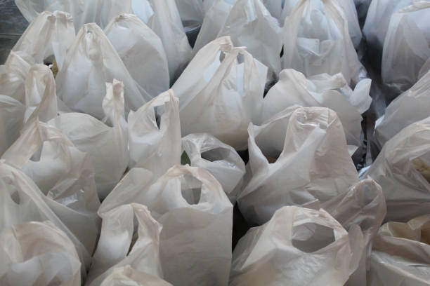 istock White plastic bag contain food package to be distributed. Flat lay or top view 2188865334