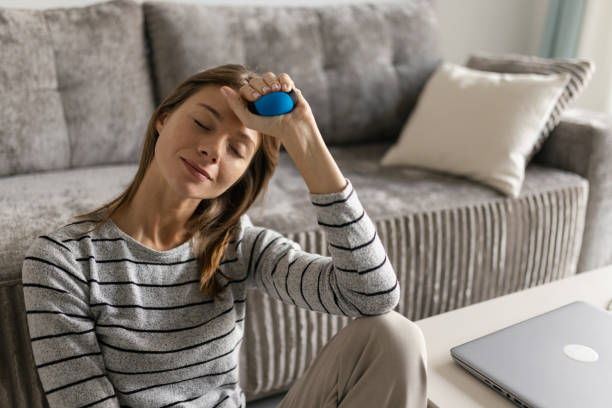 istock A woman sitting on floor and relaxing after work 2188869559