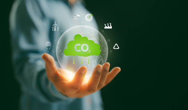 istock A Man hand showing globe with CO2 reducing icon with virtual and carbon credit to limit global warming from climate change concept. World for decrease carbon dioxide emission, carbon footprint. 2188873185