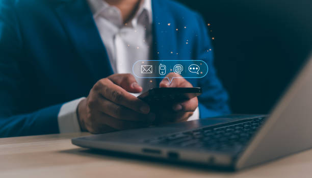 istock A Businessman using a Mobile phone touching the screen to check Chat message icons, email contact address, call phone, website internet, and social media. internet technology online business concept. 2188873346