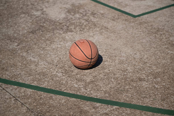 istock Basketball laying on court surface 2188874738