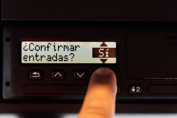 Digital tachograph screen displaying the message 'Confirm entries?' with a finger selecting 'Yes' on the OK selector.