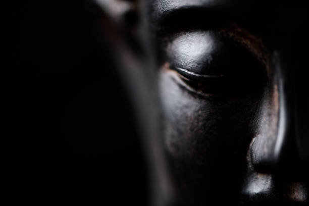 A minimalist design featuring a human silhouette subtly highlighted with a glowing effect against a textured dark blue background. The soft illumination emphasizes the profile and creates an ethereal atmosphere, symbolizing introspection, thought, and mental clarity. This conceptual composition merges simplicity with depth, ideal for themes of mindfulness, self-awareness, and mental health.