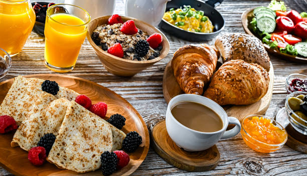 istock Breakfast served with coffee, eggs, cereals nd croissants 2188882290